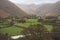 Beautiful vibrant Autumn landscape image towards Borrowdale Valley from Castle Crag in Lake Disrtrict