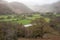 Beautiful vibrant Autumn landscape image towards Borrowdale Valley from Castle Crag in Lake Disrtrict