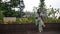 A beautiful and vibrant Indonesian woman in her late teens or early twenties. Dressed in green at Pondok Indah Mall Jakarta park