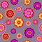 Beautiful vibrant seamless pattern with violet, yellow and red flowers