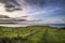 Beautiful vibrant sunrise over Mupe Bay landscape on Summer morn