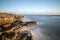 Beautiful vibrant sunset landscape image of Portland Bill rocks