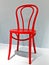 Beautiful Viennese chair painted in bright red color on a white background