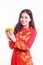 Beautiful Vietnamese woman with red ao dai holding lucky new year ornament - stack of gold