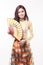 Beautiful Vietnamese young woman with modern style ao dai holding a paper fan