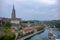 Beautiful view of aare river with Bern Munster, landmark of Bern on cloudy blue sky background