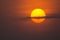 Beautiful view of the afternoon red sun with a cloudy sky - concept: mysterious