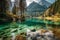 Beautiful view of alpine lake with crystal clear water in autumn, Dolomites, Italy