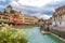 Beautiful view of Annecy town besides river Thiou against a cloudy sky