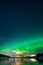 Beautiful view of the aurora, bright polar lights in the night sky.