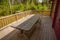 Beautiful view of backyard of private house with old wooden patio. Gorgeous green nature on summer day. Sweden.