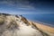 Beautiful view of the beach with cloudy sky in the background in Mazagon, Spain