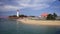 Beautiful view of the beach and pier and lighthouse at Tanjung Kalian.