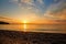 Beautiful view from the beach at the seaside with clouds at suns