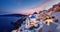 Beautiful view the blue domed churches in the village of Oia, Santorini, Greece, during dusk without people, Generative AI