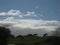 Beautiful view, blue sky, white clouds and greenfield