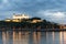 Beautiful view of Bratislava Castle on the banks of the Danube at night during the blue hour