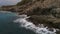 Beautiful view of the breaking waves into mountains with people in Turkey. Stormy weather. The flying copter along the