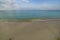 Beautiful view of calm waves rolling on sandy coast. Aruba.