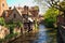 Beautiful view of the canal and traditional houses in the old town of Bruges dutch: Brugge, Belgium. Spring landscape photo