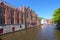 Beautiful view of the canal and traditional houses in the old town of Bruges dutch: Brugge, Belgium. Spring landscape photo