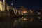 Beautiful view of Castel Sant`Angelo and the bridge at night with reflections on the Tiber river. Rome Italy