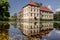 Beautiful view of Castle Strunkede in Herne; majestic building reflecting on the water surface