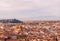 Beautiful view of city skyline, towers, basilicas, red-tiled roofs of houses and mountains, Florence, Italy