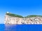 A beautiful view of the cliffs with the lighthouse Capo Caccia. Sardinia, Italy