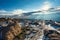 Beautiful view of the cloudy sky and sunrays from the snowy top of Evans mountain