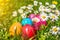 Beautiful view of colorful Easter eggs lying in the grass