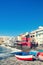 Beautiful view of El Medano, little town in the south of Tenerife. Red wooden fishing boats on the beach.