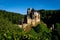 Beautiful view of Eltz Castle surrounded by trees on a sunny day