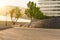 Beautiful view of an empty tiled pavement in front of modern office buildings