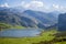 Beautiful view of Ercina Lake in Covadonga Lakes, Asturias, Spain. Green grassland with mountains at the background