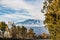 A beautiful view of the eruption of volcano Etna with smoke and snow is in the photo in winter in Sicily