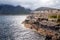 Beautiful view of evening ripple sea and mountains in the distance from the rocky shore, where cod heads hanging from A-shaped