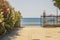 Beautiful view of exit to beach through flower alley to Mediterranean sea.