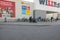 Beautiful view of facade of Willy:s supermarket with people entering and leaving it.