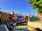 A beautiful view of the famous canals and colourful homes of the island town of Burano, Italy on a beautiful morning.