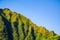 Beautiful view of the famous mountain landscape near the haiku stairs on a blue sky background