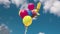 Beautiful view of festive balloons for child  birthday of 7 year old child developing in  wind against blue sky with white clouds.