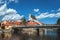 Beautiful view of the fragment of the bridge and the town of Cesky Krumlov with the Vltava river on a Sunny day.