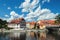 Beautiful view of the fragment of the bridge and the town of Cesky Krumlov with the Vltava river on a Sunny day.