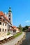 Beautiful view of the fragment of the bridge and the town of Cesky Krumlov with the Vltava river on a Sunny day.