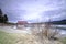 Beautiful view of frozen Maligne Lake with boat house, red roof in Jasper National Park