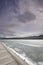 Beautiful view of frozen Maligne Lake, wooden platform in front, Jasper National Park