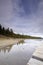 Beautiful view of frozen Maligne Lake, wooden platform in front, Jasper National Park