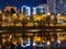 Beautiful view of the glowing night cityscape near the embankment of the Kuban. The embankment is illuminated by street lamps