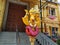 Beautiful view of Goddess Face in the Yellow Color Trishula or Trident in front of the Sri Gangamma Devi Temple Near Kadu